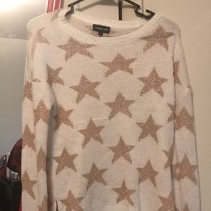 White sweater with gold stars